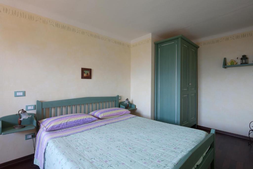 Postel nebo postele na pokoji v ubytování B&B La Pulce Dorata