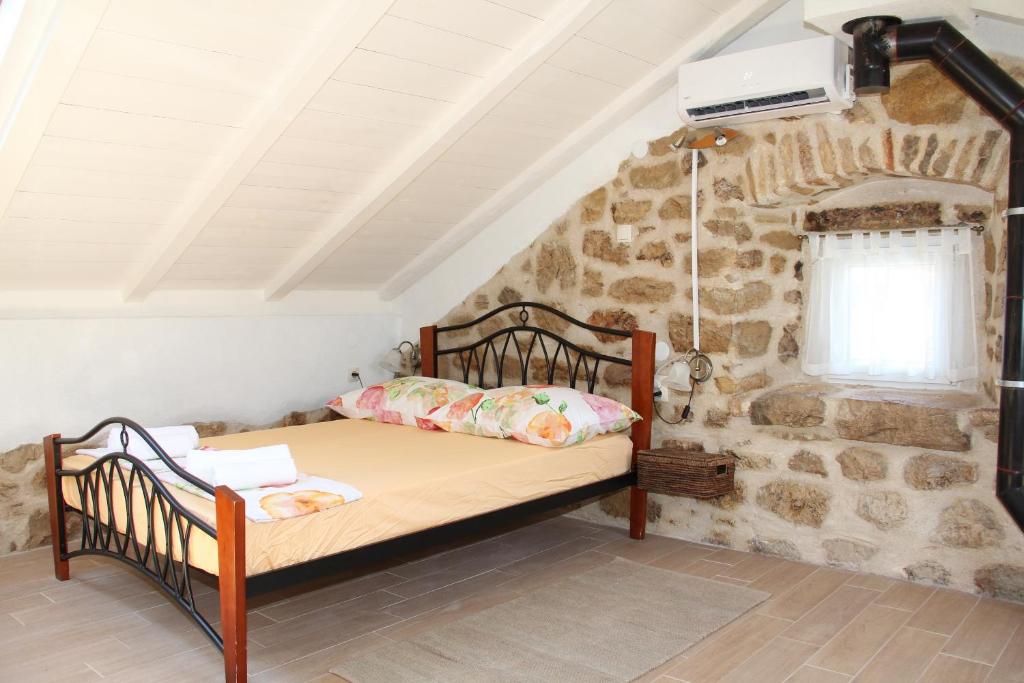 A bed or beds in a room at Vacation home Ania