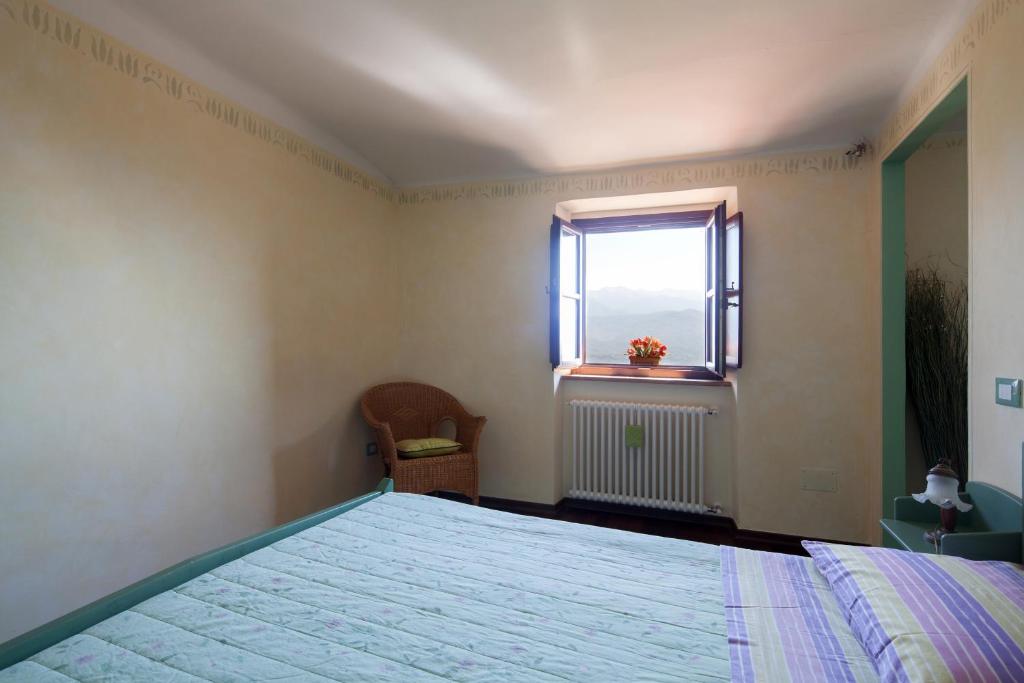 Postel nebo postele na pokoji v ubytování B&B La Pulce Dorata