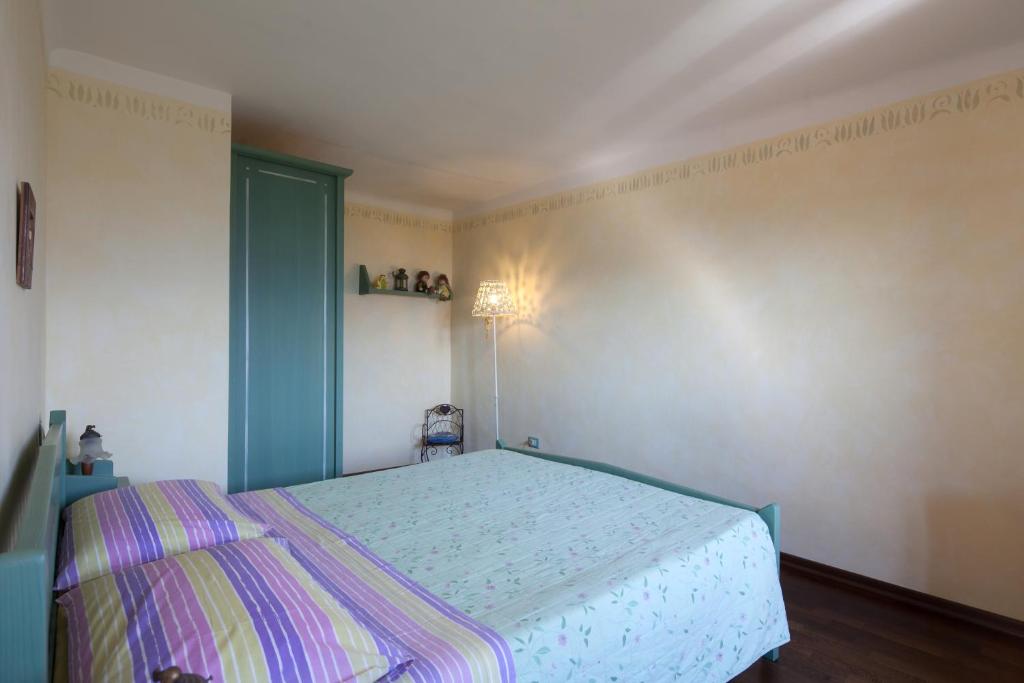 Postel nebo postele na pokoji v ubytování B&B La Pulce Dorata