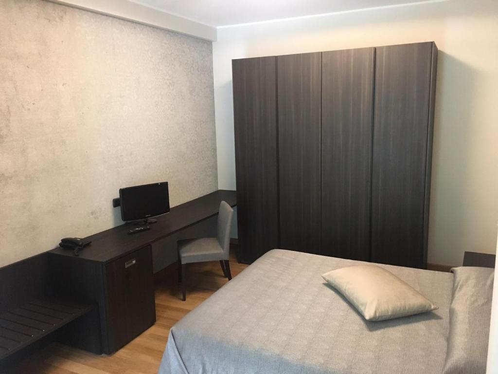 Postel nebo postele na pokoji v ubytování Hotel Maloia