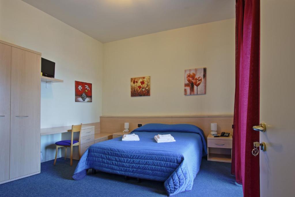 Postel nebo postele na pokoji v ubytování Hotel Aquavite