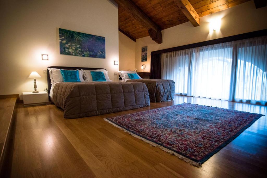 Postel nebo postele na pokoji v ubytování Residence Cà Beregana