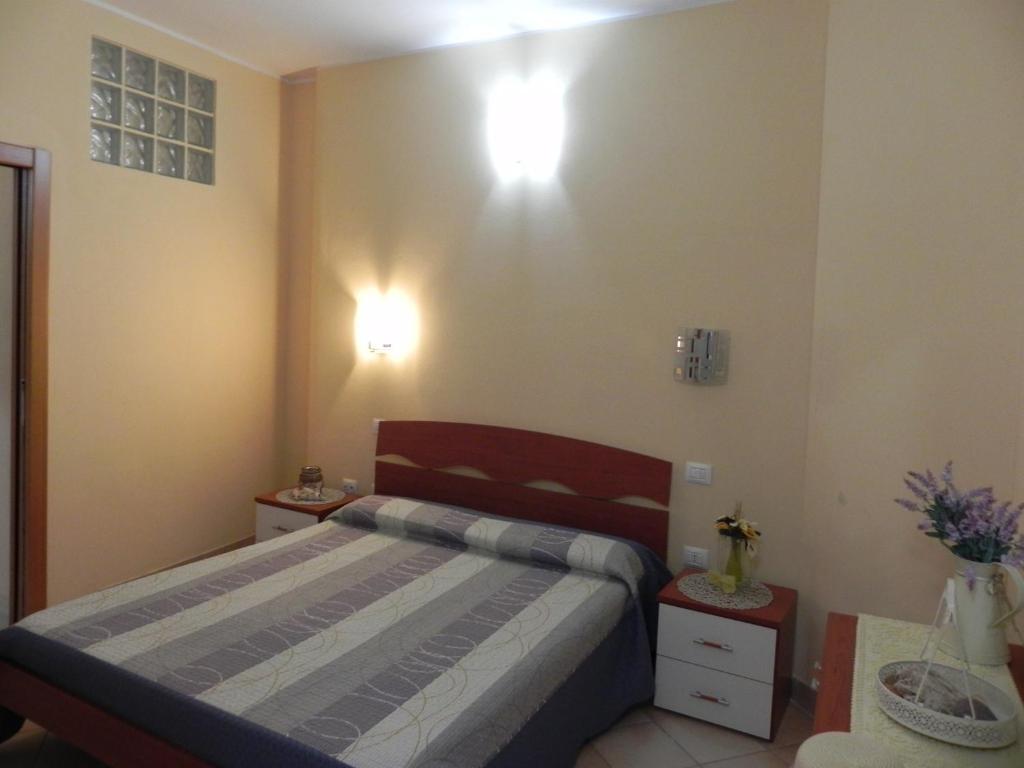 Postel nebo postele na pokoji v ubytování Buggerru a Mare Residence