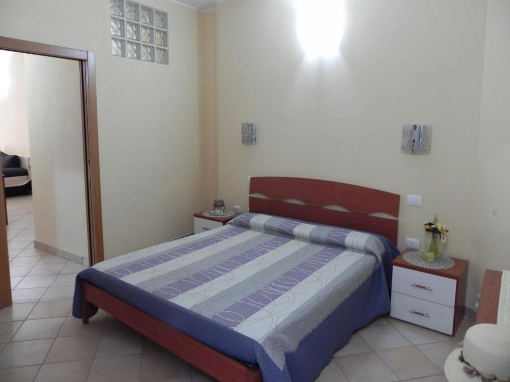 Postel nebo postele na pokoji v ubytování Buggerru a Mare Residence