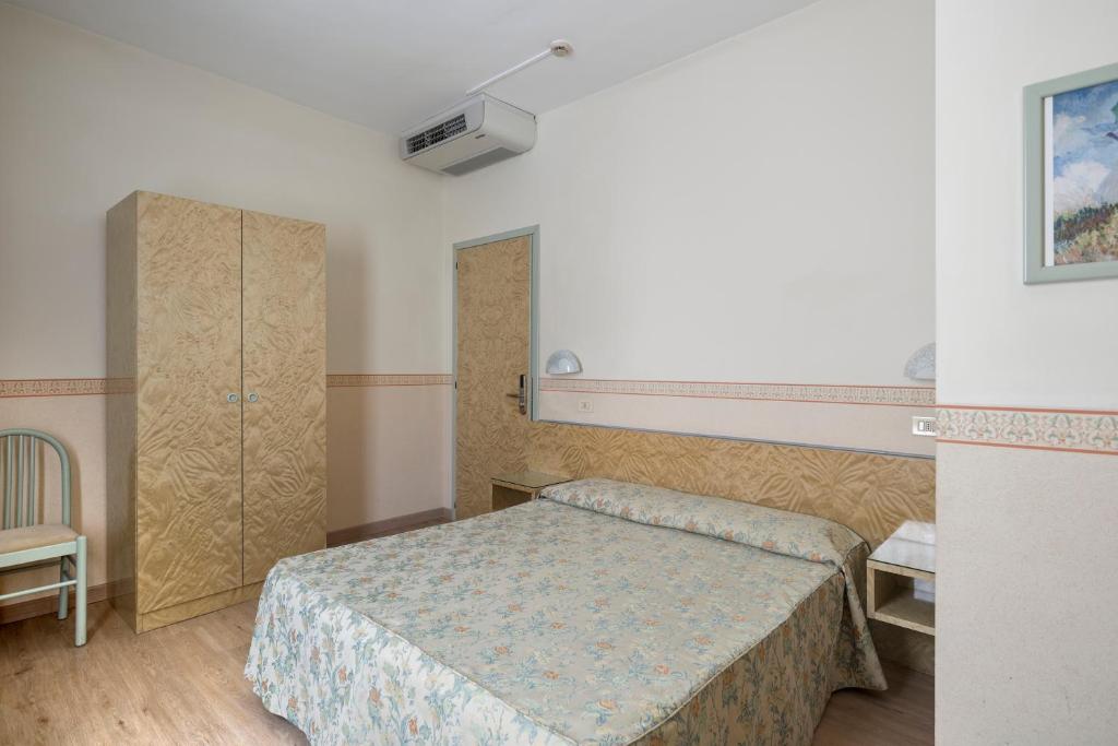 Postel nebo postele na pokoji v ubytování Hotel Garibaldi