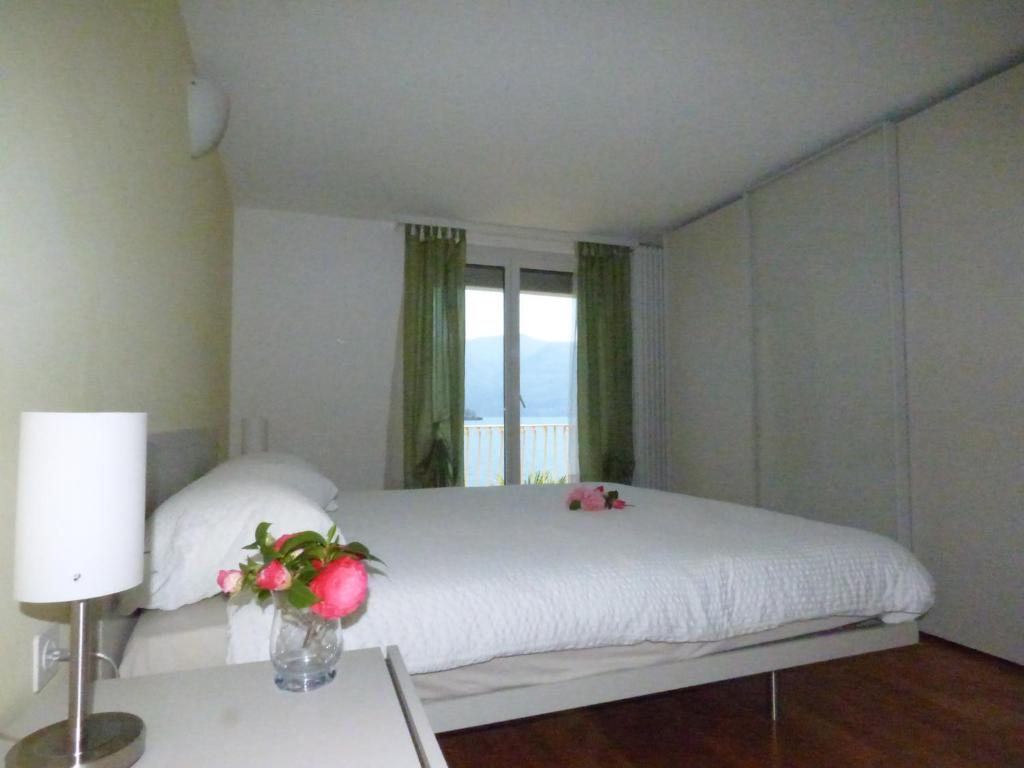 Postel nebo postele na pokoji v ubytování Casa Conti al Lago