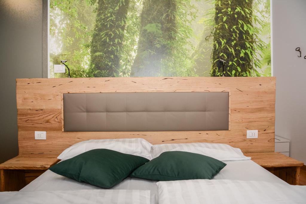 Postel nebo postele na pokoji v ubytování Villa Torbole
