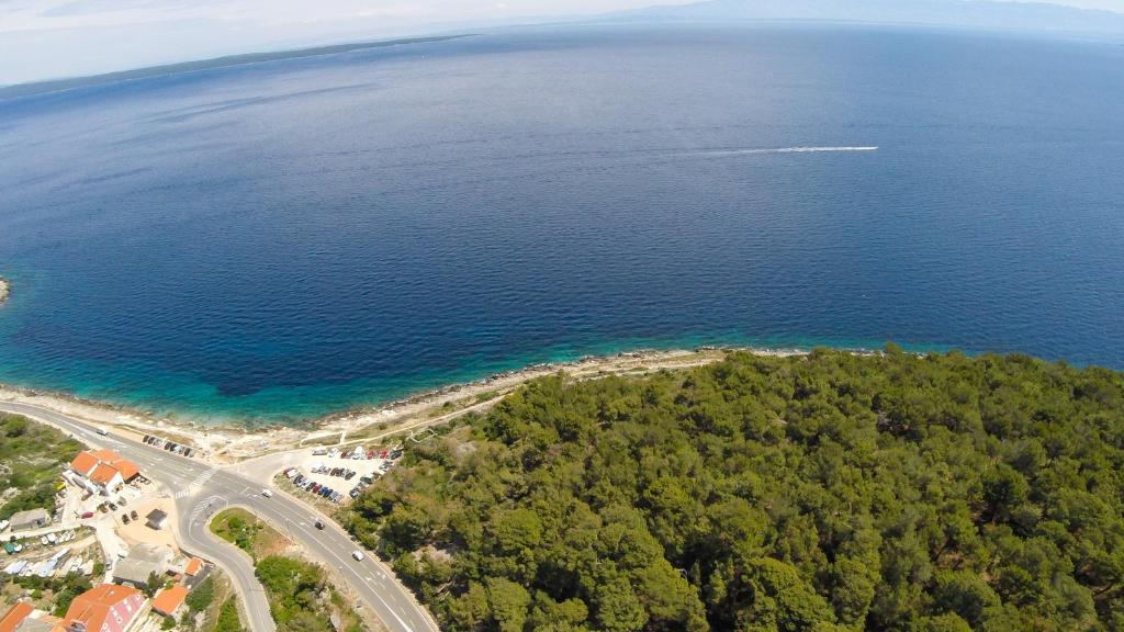 an aerial view of the ocean and a road at The Look in Mali Lošinj