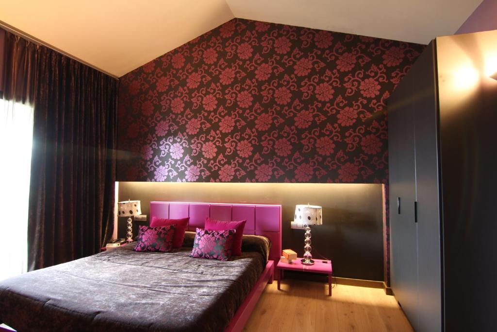 Postel nebo postele na pokoji v ubytování Dolcet L´Hotel