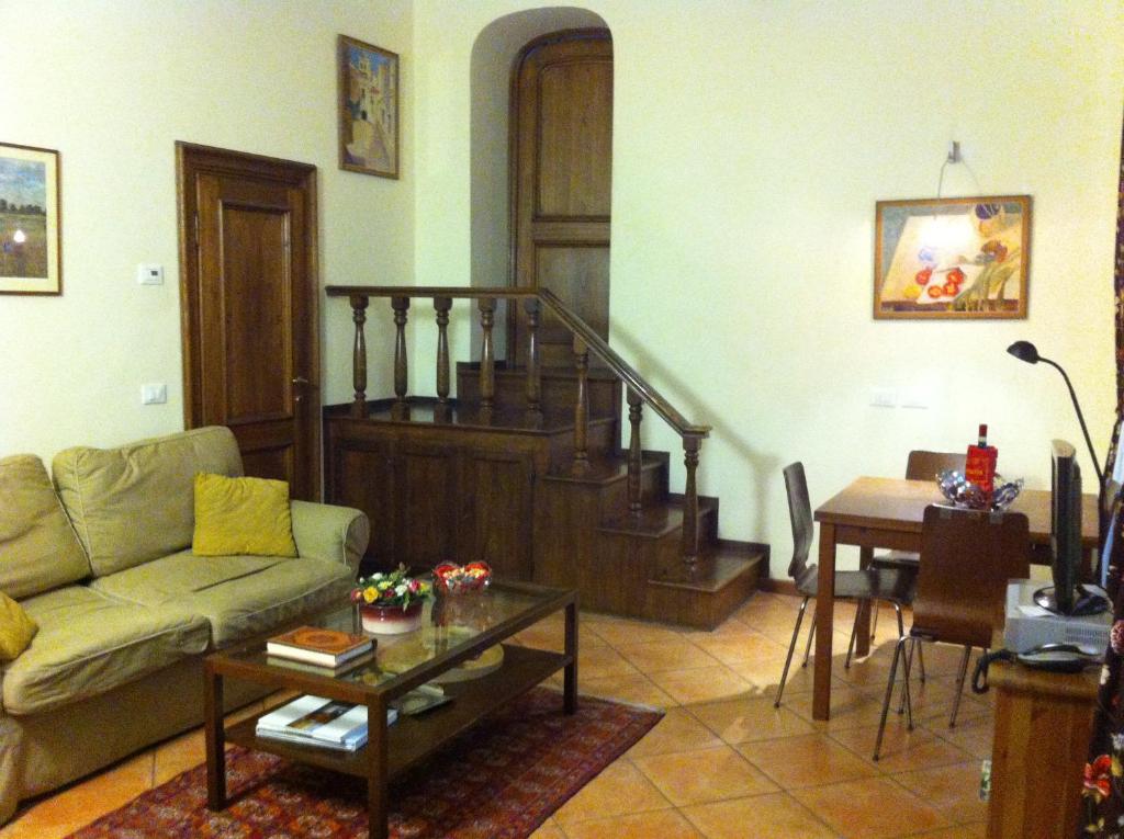a living room with a couch and a table at Leoni in Florence