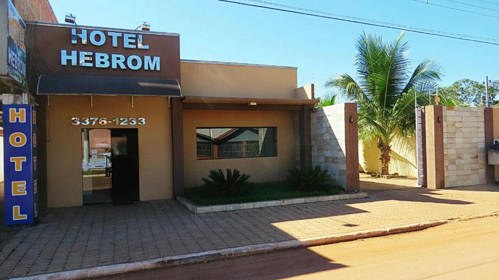 a hotel hebrew sign in front of a building at Hotel Hebrom in Nobres