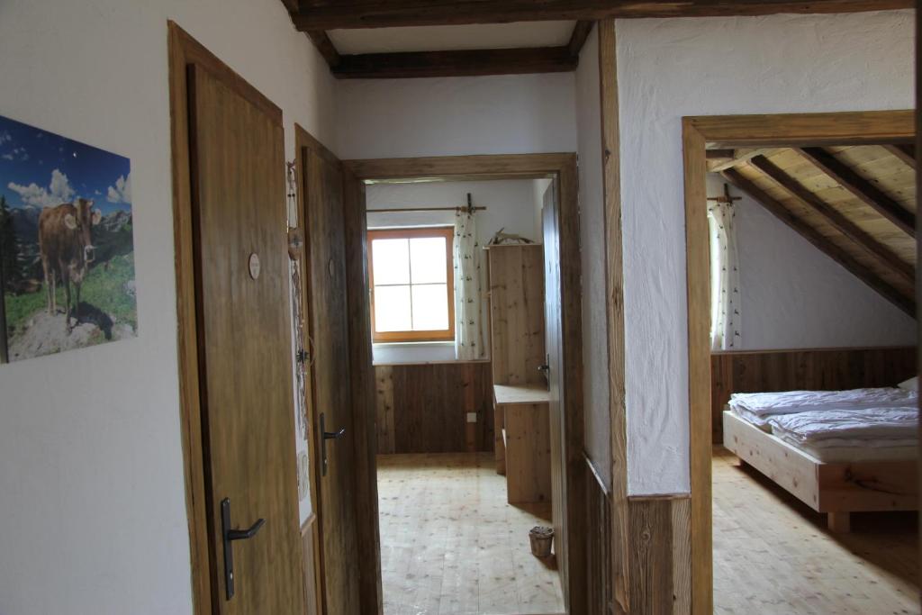 Postel nebo postele na pokoji v ubytování Almchalet Feuerkogel