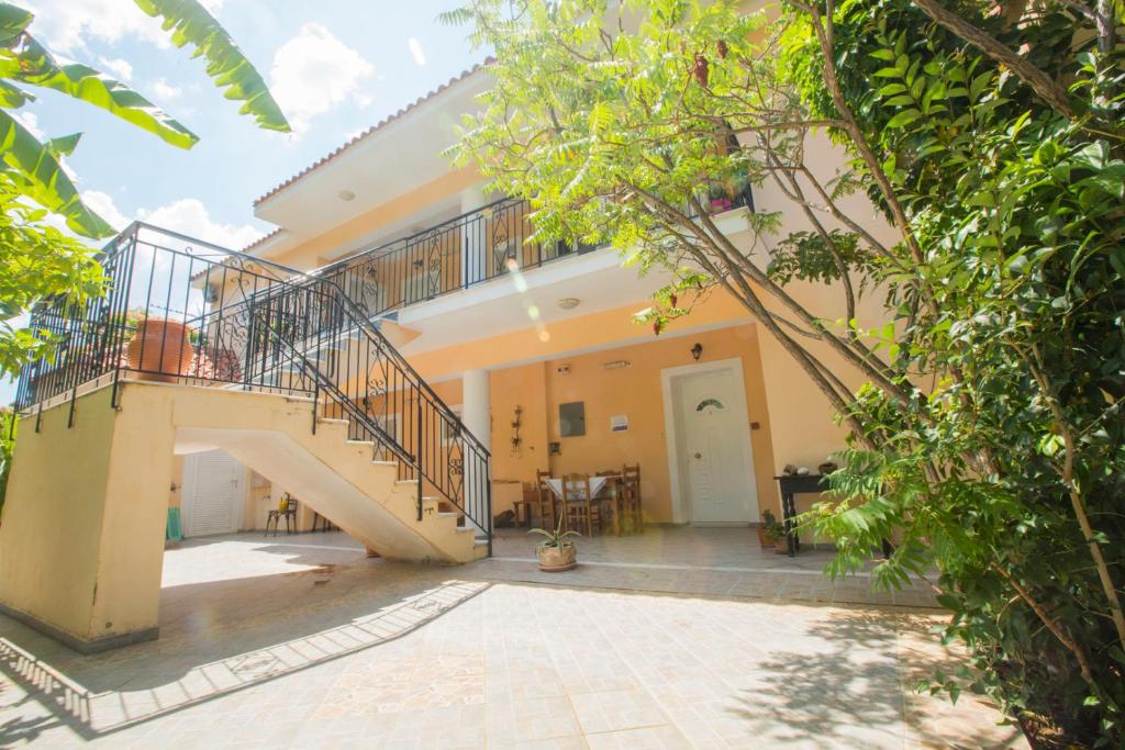 a courtyard of a house with a staircase at Summer Dream in Vlachata