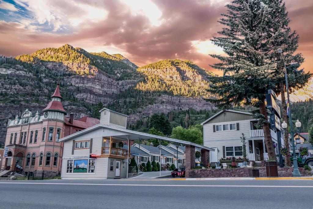 a small town with a mountain in the background at Abram Inn & Suites in Ouray