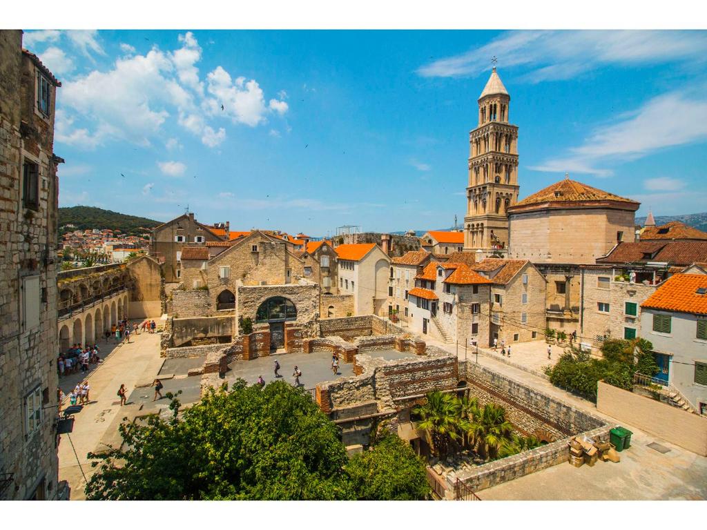 a view of a city with a clock tower at Palace Tower View in Split