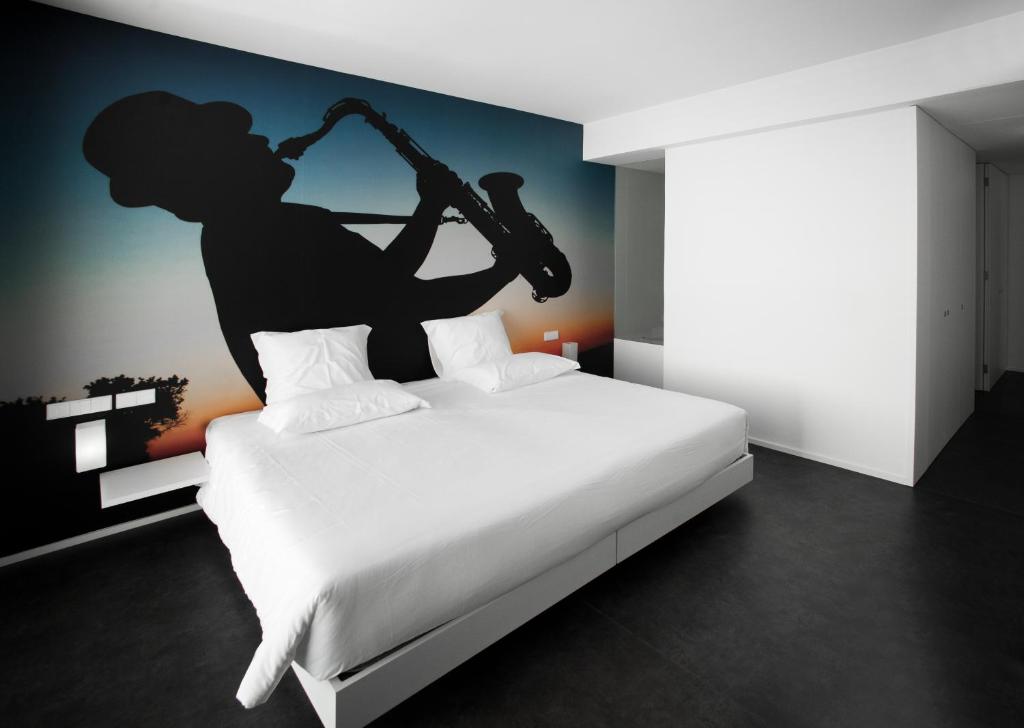 Postel nebo postele na pokoji v ubytování Design & Wine Hotel