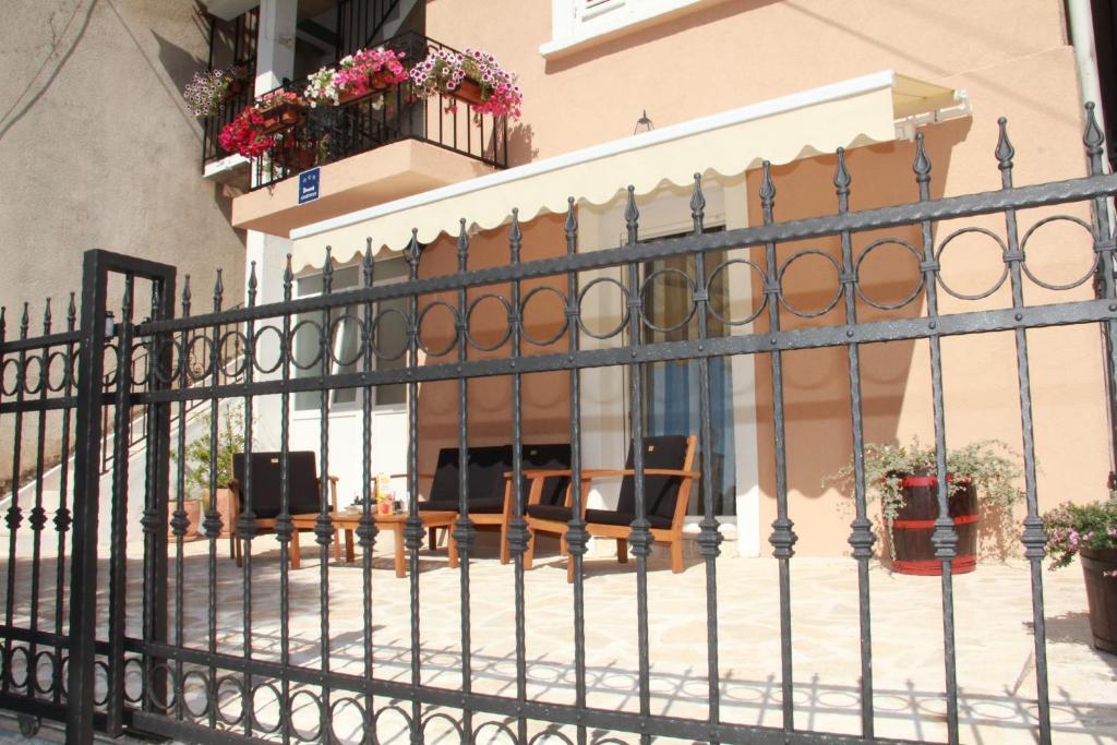 a wrought iron fence in front of a building at Apartment Bruno in Šibenik