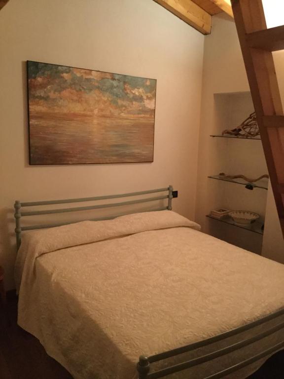 Postel nebo postele na pokoji v ubytování Appartamento Terrazza sul Porto