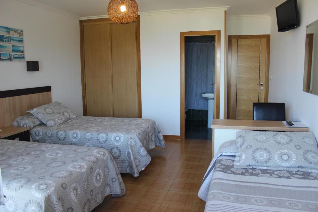 Postel nebo postele na pokoji v ubytování Hotel Estrella del Mar