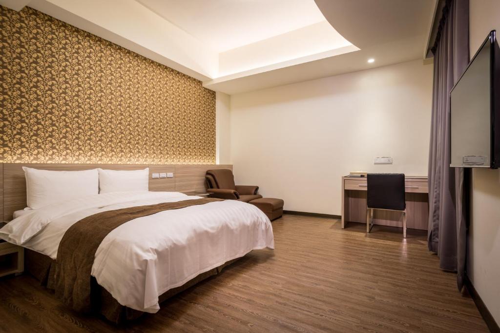 Postel nebo postele na pokoji v ubytování Midu Business Hotel