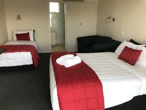 Postel nebo postele na pokoji v ubytování Ascot Oamaru Motel