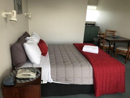 Postel nebo postele na pokoji v ubytování Ascot Oamaru Motel