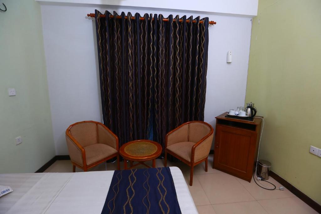 Postel nebo postele na pokoji v ubytování Peradeniya Rest House