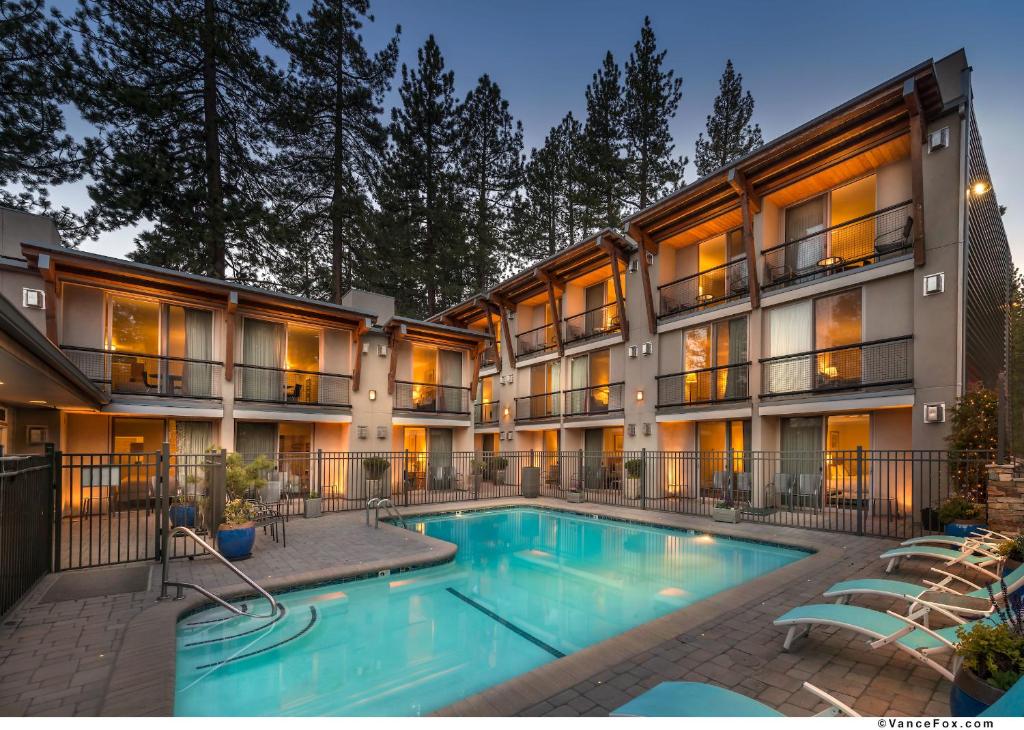 a hotel with a swimming pool in front of a building at Firelite Lodge in Tahoe Vista