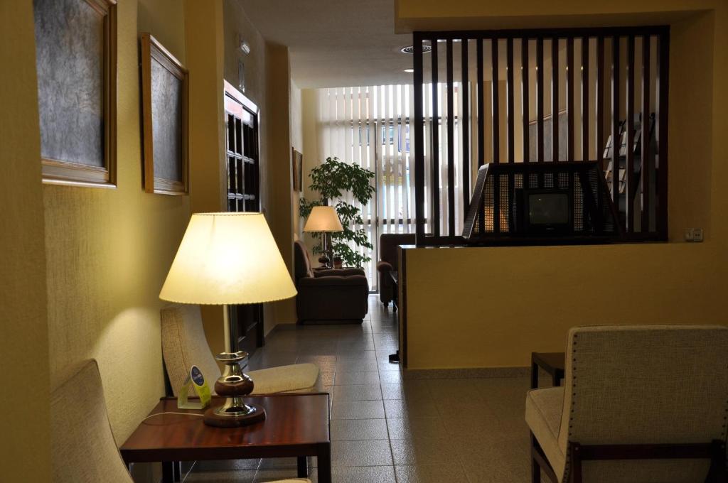 TV a/nebo společenská místnost v ubytování Hotel Riviera