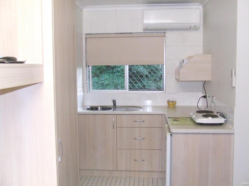 Kuchyň nebo kuchyňský kout v ubytování Mango Tree Motel