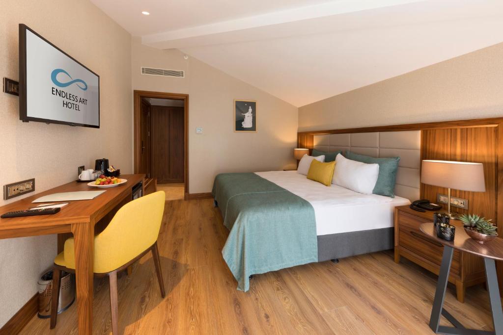 A bed or beds in a room at Endless Art Hotel-Special Category