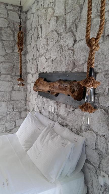 Postel nebo postele na pokoji v ubytování Milo Milo Suites