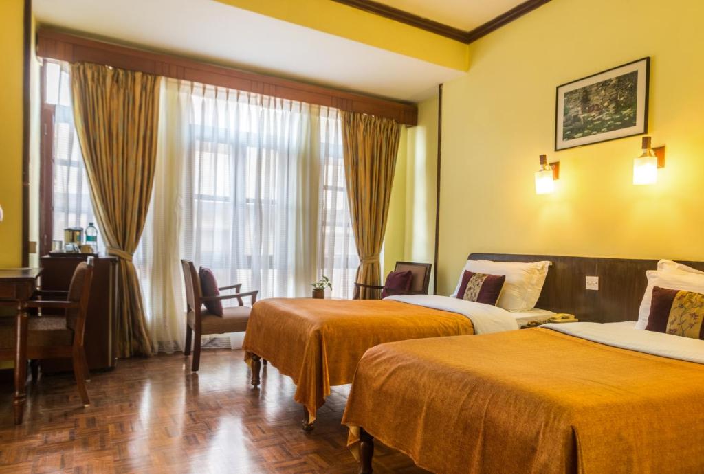 Postel nebo postele na pokoji v ubytování Hotel Excelsior