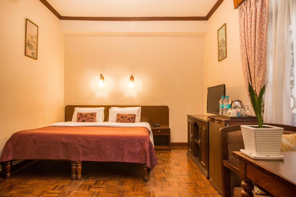 Postel nebo postele na pokoji v ubytování Hotel Excelsior