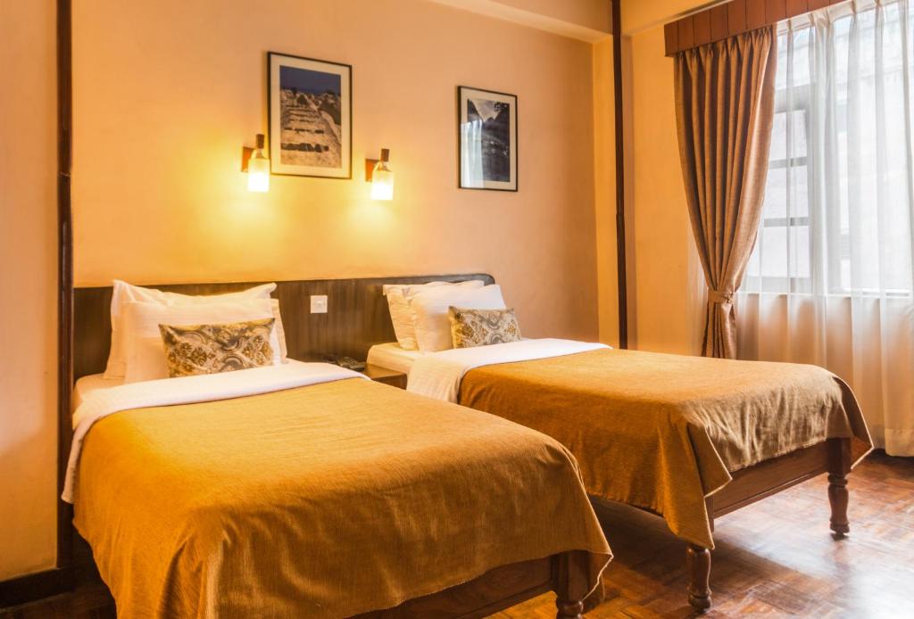 Postel nebo postele na pokoji v ubytování Hotel Excelsior