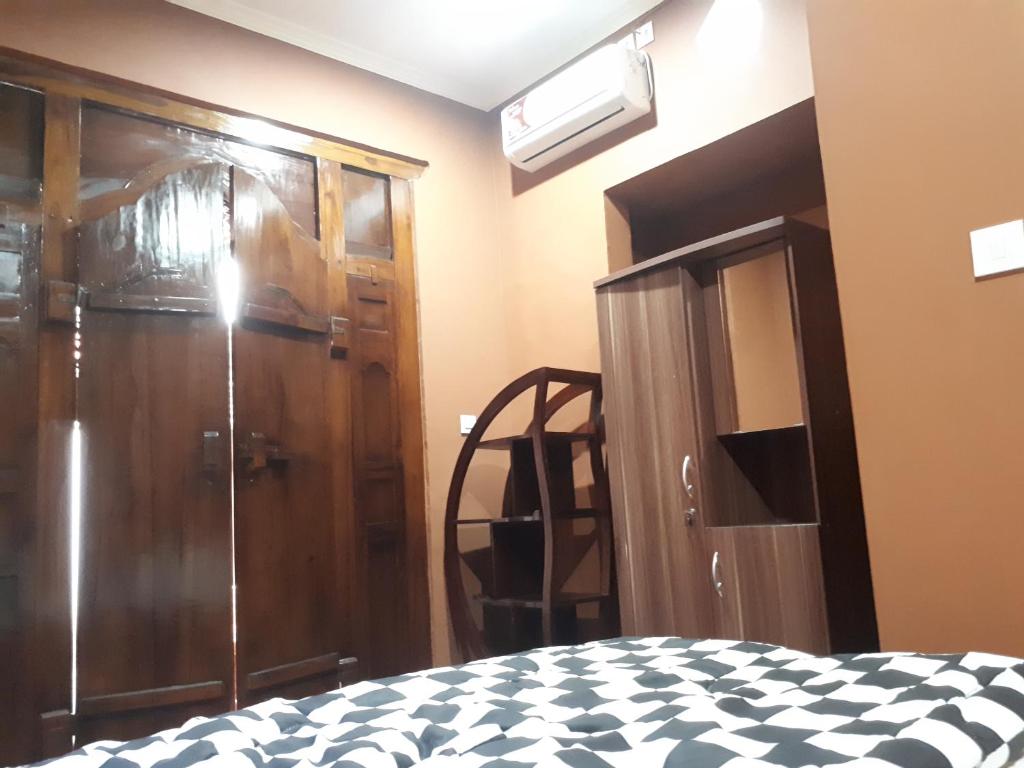 Postel nebo postele na pokoji v ubytování Indy House