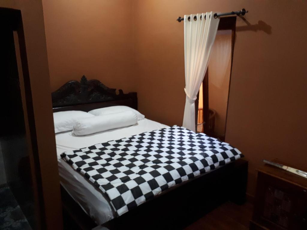 Postel nebo postele na pokoji v ubytování Indy House
