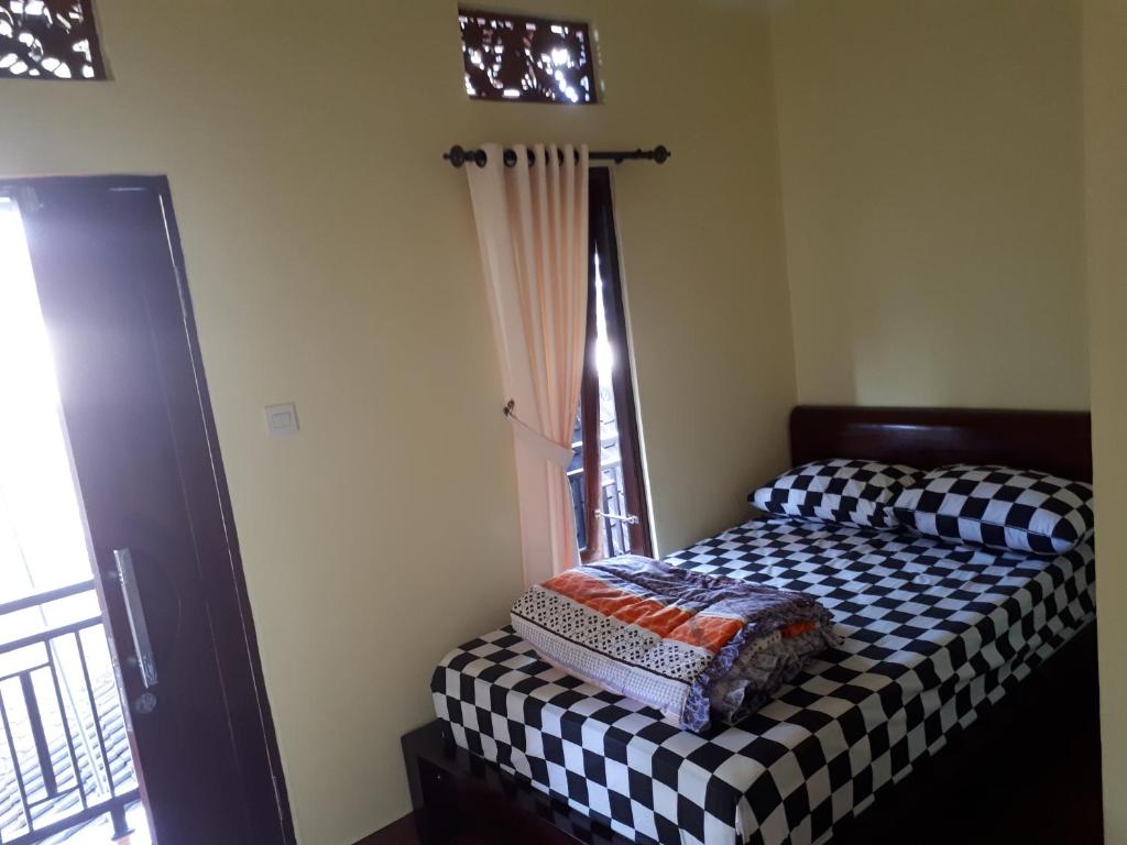 Postel nebo postele na pokoji v ubytování Indy House