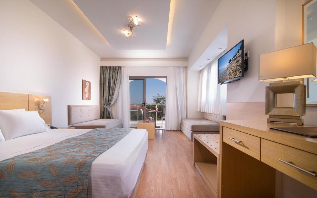 A bed or beds in a room at Flegra Palace