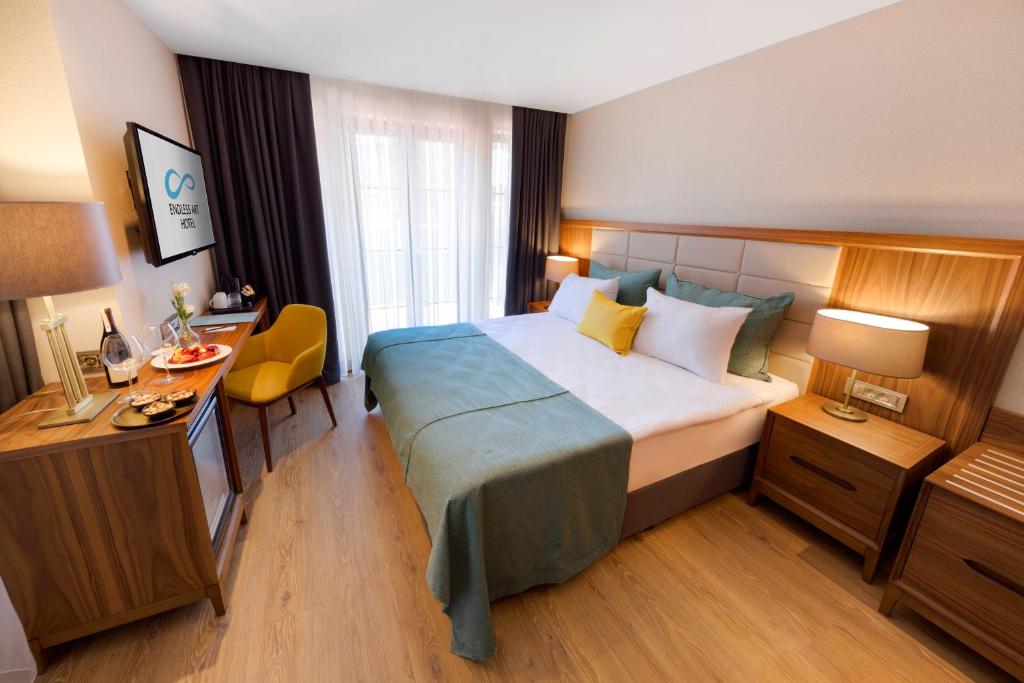 A bed or beds in a room at Endless Art Hotel-Special Category