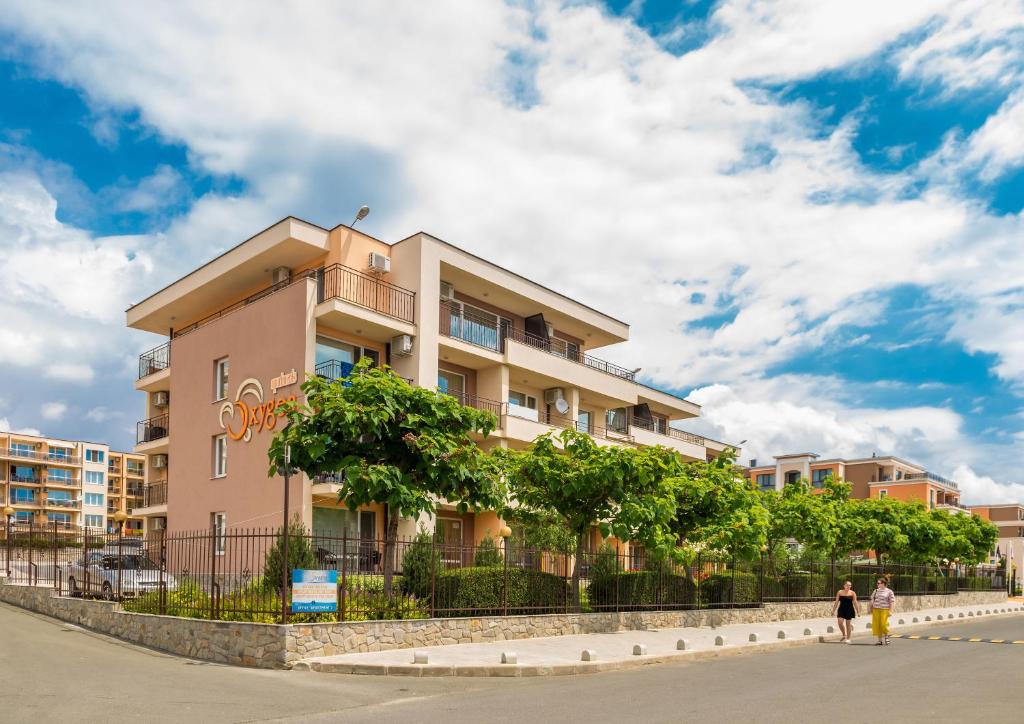 a building on the side of a street at Oxygen Apartments in Sveti Vlas