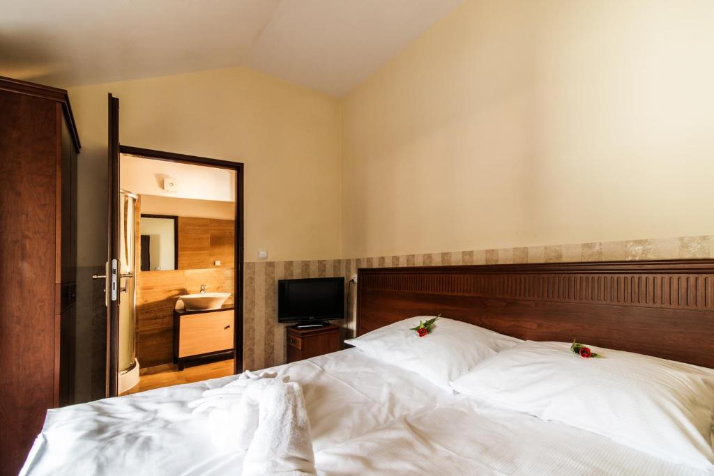 Postel nebo postele na pokoji v ubytování Perła Karkonoszy SPA - W samym centrum Karpacza