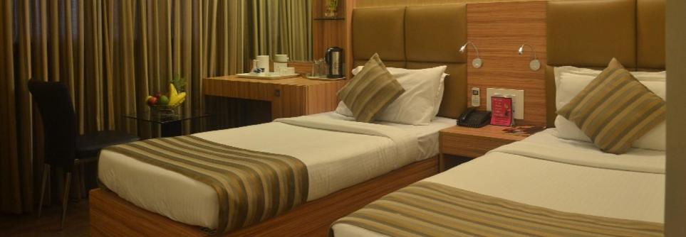 Postel nebo postele na pokoji v ubytování Hotel Plaza