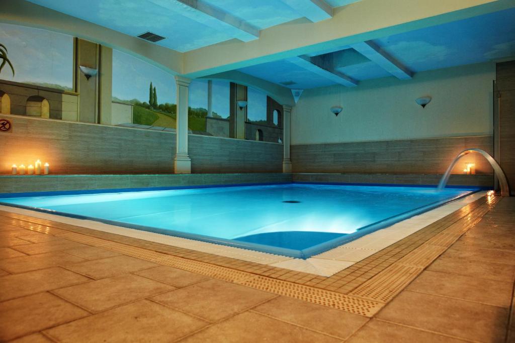a large swimming pool in a house at Hotel Villa Bohema in Kazimierz Dolny