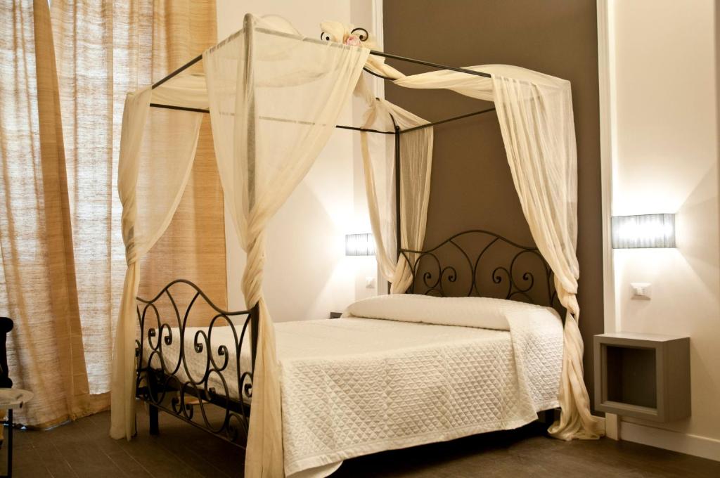 Letto o letti in una camera di B&B Le Stanze del Duomo