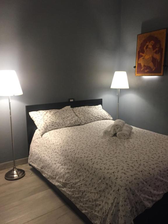 Postel nebo postele na pokoji v ubytování Corridoni Suites