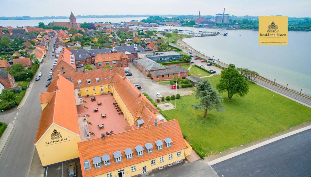 an aerial view of a building next to a river at Hotel Residens Møen in Stege