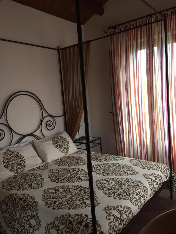Postel nebo postele na pokoji v ubytování Etna Hotel