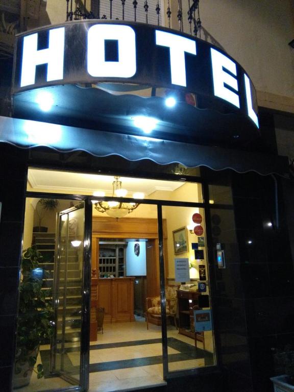a store front with a sign that reads hotel at Hotel Victoria in Zafra